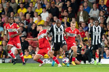 Edo Kayembe #39 of Watford battle for the ball Alex Mowatt #4 of Middlesbrough