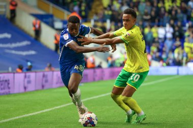Josh William  #48 of Birmingham City dribbles the ball whilst under pressure from  Aaron Ramsey #20 of Norwich City