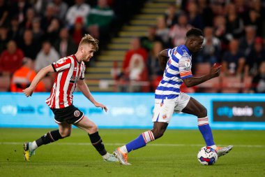 Tommy Doyle #22 of Sheffield United and Andy Yiadom #17 of Reading during the Sky Bet Championship match Sheffield United vs Reading at Bramall Lane, Sheffield, UK, 30th August 2022