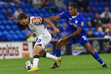 Luke Freeman #30 of Luton Town Under pressure from Andy Rinomhota #35 of Cardiff City  