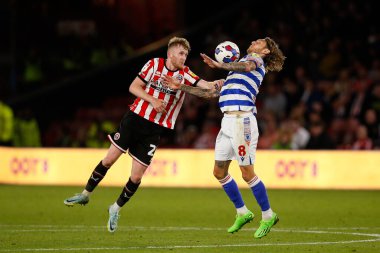 Tommy Doyle #22 of Sheffield United and Jeff Hendricks #8 of Reading  during the Sky Bet Championship match Sheffield United vs Reading at Bramall Lane, Sheffield, UK, 30th August 2022