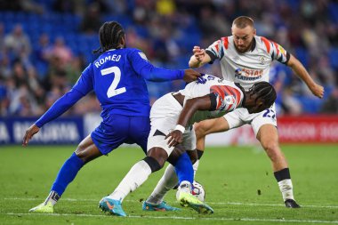 Mahlon Romeo #2 of Cardiff City  and Amarii Bell #29 and Allan Campbell #22 of Luton Town battle for the ball 