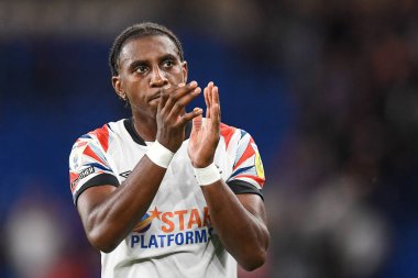 Amarii Bell #29 of Luton Town Applauds the travelling supporters 