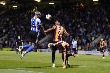 Callum Paterson #13 of Sheffield Wednesday competes for a header with Lee Angol #7 of Bradford City 