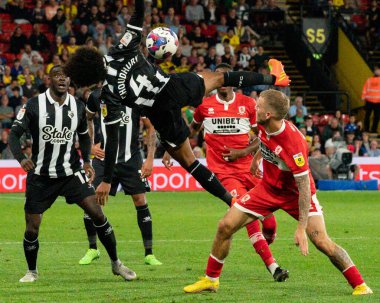 Hamza Choudhury #4 of Watford battle for the ball with Riley McGree #8 of Middlesbrough