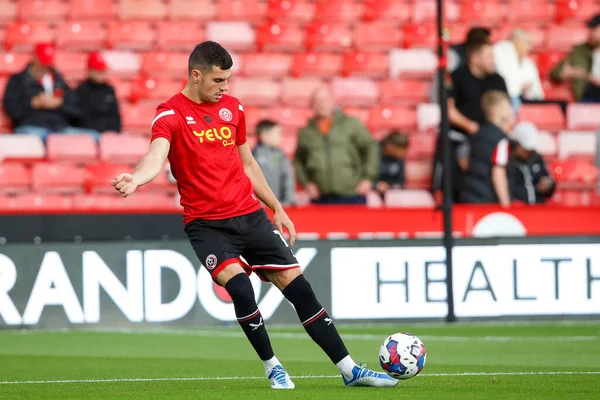 John Egan #12 of Sheffield United warms up before the Sky Bet Championship match Sheffield United vs Reading at Bramall Lane, Sheffield, UK, 30th August 2022