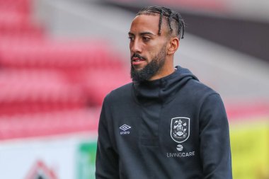 Sorba Thomas #7 of Huddersfield Town arrives at the game ahead of kick off