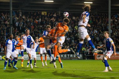Rhys Williams #15 of Blackpool wins the header on goal