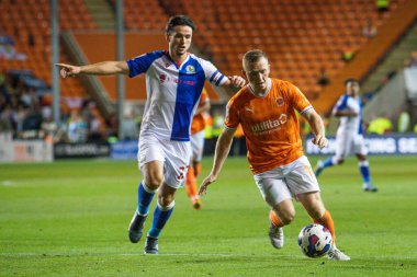 Shayne Lavery #19 of Blackpool makes a break with the ball