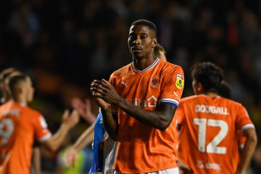 A dejected Marvin Ekpiteta #21 of Blackpool applauds the fans at the end of the game