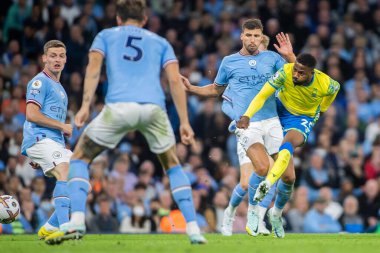 Emmanuel Dennis #25 of Nottingham Forest gets a shot away under pressure