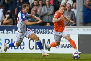 Shayne Lavery #19 of Blackpool makes a break with the ball