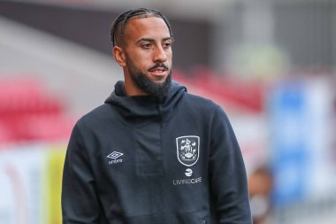 Sorba Thomas #7 of Huddersfield Town arrives at the game ahead of kick off