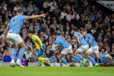 Morgan Gibbs-White #10 of Nottingham Forest looks to take on the City midfield