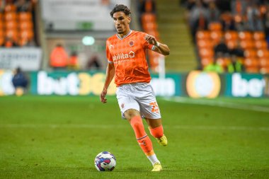 Theo Corbeanu #25 of Blackpool makes a break with the ball