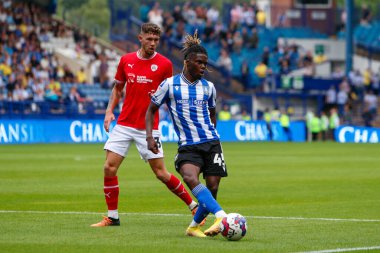 Alex Mighten #45 of Sheffield Wednesday and Matty Wolfe #33 of Barnsley during the Sky Bet League 1 match Sheffield Wednesday vs Barnsley at Hillsborough, Sheffield, United Kingdom, 3rd September 202
