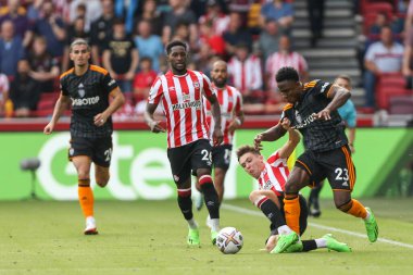 Aaron Hickey #2 of Brentford tackles Luis Sinisterra #23 of Leeds United during the Premier League match Brentford vs Leeds United at Brentford Community Stadium, London, United Kingdom, 3rd September 202