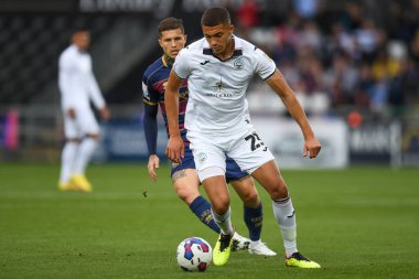 Nathan Wood #23 of Swansea City Under pressure from Lyndon Dykes #9 of QPR during the Sky Bet Championship match Swansea City vs Queens Park Rangers at Swansea.com Stadium, Swansea, United Kingdom, 3rd September 202