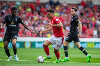 Brennan Johnson #20 of Nottingham Forest takes on the Bournemouth defence during the Premier League match Nottingham Forest vs Bournemouth at City Ground, Nottingham, United Kingdom, 3rd September 202