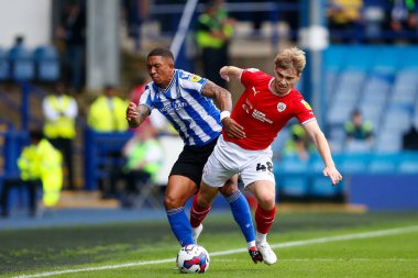Luca Connell #48 of Barnsley and Liam Palmer #2 of Sheffield Wednesday during the Sky Bet League 1 match Sheffield Wednesday vs Barnsley at Hillsborough, Sheffield, United Kingdom, 3rd September 2022