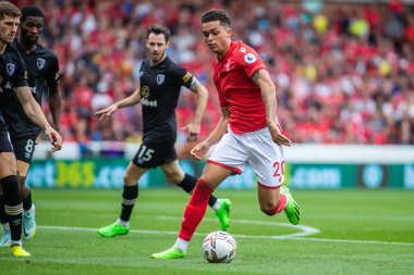Brennan Johnson #20 of Nottingham Forest takes on the Bournemouth defence during the Premier League match Nottingham Forest vs Bournemouth at City Ground, Nottingham, United Kingdom, 3rd September 202