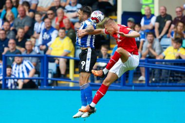 Lee Gregory #9 of Sheffield Wednesday and Mads Andersen #6 of Barnsley during the Sky Bet League 1 match Sheffield Wednesday vs Barnsley at Hillsborough, Sheffield, United Kingdom, 3rd September 202