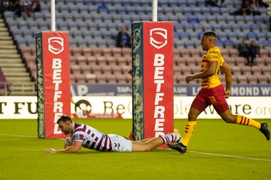 Kaide Ellis #15 of Wigan Warriors dives over to score during the Betfred Super League match Wigan Warriors vs Catalans Dragons at DW Stadium, Wigan, United Kingdom, 2nd September 202