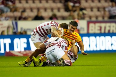 Tiaki Chan #33 of Catalans Dragons is tackled during the Betfred Super League match Wigan Warriors vs Catalans Dragons at DW Stadium, Wigan, United Kingdom, 2nd September 202