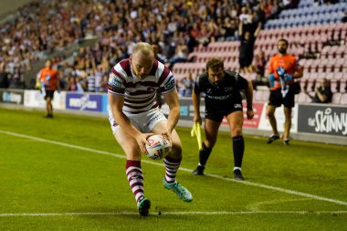 Liam Marshall #5 of Wigan Warriors touches down to score his second try during the Betfred Super League match Wigan Warriors vs Catalans Dragons at DW Stadium, Wigan, United Kingdom, 2nd September 202