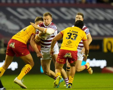 Mike Cooper #36 of Wigan Warriors runs at the Dragons defence during the Betfred Super League match Wigan Warriors vs Catalans Dragons at DW Stadium, Wigan, United Kingdom, 2nd September 202