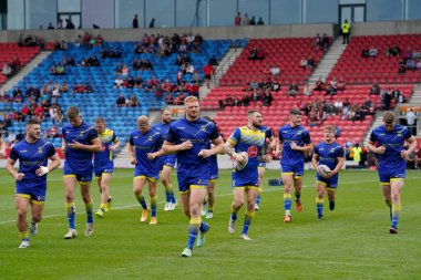 Joe Bullock #15 of Warrington Wolves leads the team out for the warm up before the Betfred Super League match Salford Red Devils vs Warrington Wolves at AJ Bell Stadium, Eccles, United Kingdom, 3rd September 202