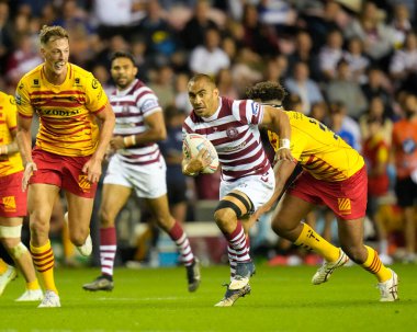 Thomas Leuluai #7 of Wigan Warriors makes a break past Corentin Le Cam #21 of Catalans Dragons during the Betfred Super League match Wigan Warriors vs Catalans Dragons at DW Stadium, Wigan, United Kingdom, 2nd September 202