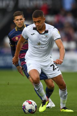 Nathan Wood #23 of Swansea City Under pressure from Lyndon Dykes #9 of QPR during the Sky Bet Championship match Swansea City vs Queens Park Rangers at Swansea.com Stadium, Swansea, United Kingdom, 3rd September 202