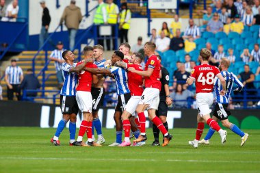 Players clash during the Sky Bet League 1 match Sheffield Wednesday vs Barnsley at Hillsborough, Sheffield, United Kingdom, 3rd September 202