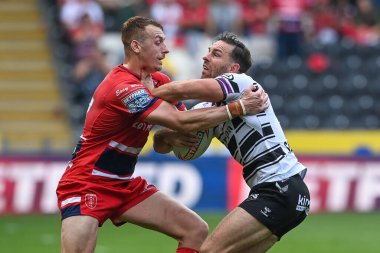 Luke Gale #7 of Hull FC is tackled by Frankie Halton #27 of Hull KR during the Betfred Super League match Hull FC vs Hull KR at MKM Stadium, Hull, United Kingdom, 3rd September 202