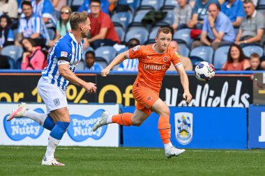Shayne Lavery #19 of Blackpool makes a break with the ball during the Sky Bet Championship match Huddersfield Town vs Blackpool at John Smith's Stadium, Huddersfield, United Kingdom, 4th September 202