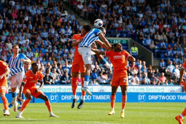 Jon Russell #5 of Huddersfield Town attempts a header at goal during the Sky Bet Championship match Huddersfield Town vs Blackpool at John Smith's Stadium, Huddersfield, United Kingdom, 4th September 202
