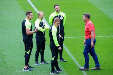 Match officials consult the groundsman over the pitch markings before the Sky Bet Championship match Huddersfield Town vs Blackpool at John Smith's Stadium, Huddersfield, United Kingdom, 4th September 202