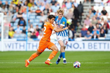 Kenny Dougall #12 of Blackpool and Jack Rudoni #22 of Huddersfield Town during the Sky Bet Championship match Huddersfield Town vs Blackpool at John Smith's Stadium, Huddersfield, United Kingdom, 4th September 202