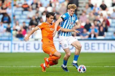 Kenny Dougall #12 of Blackpool and Jack Rudoni #22 of Huddersfield Town during the Sky Bet Championship match Huddersfield Town vs Blackpool at John Smith's Stadium, Huddersfield, United Kingdom, 4th September 202