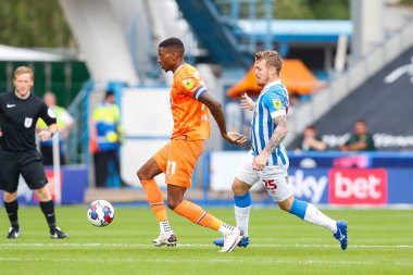 Marvin Ekpiteta #21 of Blackpool and Danny Ward #25 of Huddersfield Town during the Sky Bet Championship match Huddersfield Town vs Blackpool at John Smith's Stadium, Huddersfield, United Kingdom, 4th September 202