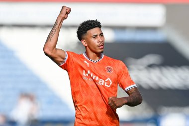 Jordan Lawrence-Gabriel #4 of Blackpool celebrates with the fans at the end of the Sky Bet Championship match Huddersfield Town vs Blackpool at John Smith's Stadium, Huddersfield, United Kingdom, 4th September 202