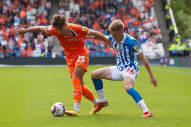 Pat Jones #26 of Huddersfield Town and Theo Corbeanu #25 of Blackpool during the Sky Bet Championship match Huddersfield Town vs Blackpool at John Smith's Stadium, Huddersfield, United Kingdom, 4th September 202