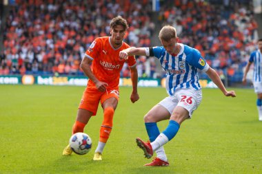 Pat Jones #26 of Huddersfield Town and Theo Corbeanu #25 of Blackpool during the Sky Bet Championship match Huddersfield Town vs Blackpool at John Smith's Stadium, Huddersfield, United Kingdom, 4th September 202