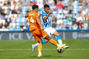 Jordan Lawrence-Gabriel #4 of Blackpool and Kaine Kesler-Hayden #16 of Huddersfield Town during the Sky Bet Championship match Huddersfield Town vs Blackpool at John Smith's Stadium, Huddersfield, United Kingdom, 4th September 202