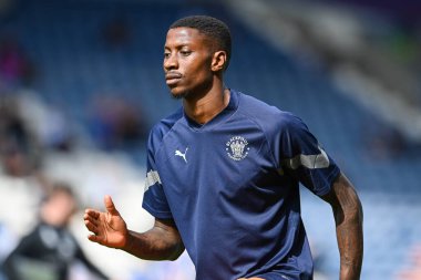 Marvin Ekpiteta #21 of Blackpool warms up ahead of the Sky Bet Championship match Huddersfield Town vs Blackpool at John Smith's Stadium, Huddersfield, United Kingdom, 4th September 202