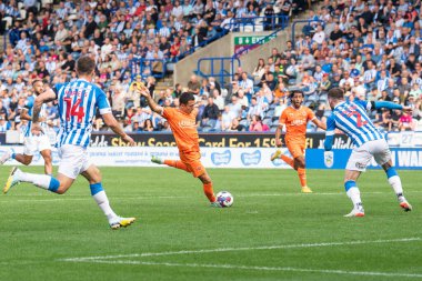 Ian Poveda #26 of Blackpool shoots on goal during the Sky Bet Championship match Huddersfield Town vs Blackpool at John Smith's Stadium, Huddersfield, United Kingdom, 4th September 202