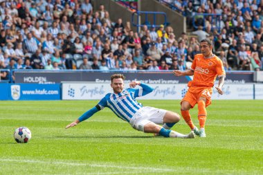 Ian Poveda #26 of Blackpool shoots on goal during the Sky Bet Championship match Huddersfield Town vs Blackpool at John Smith's Stadium, Huddersfield, United Kingdom, 4th September 202
