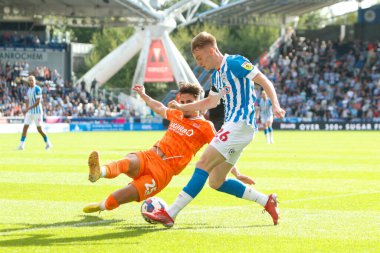 Pat Jones #26 of Huddersfield Town and Theo Corbeanu #25 of Blackpool during the Sky Bet Championship match Huddersfield Town vs Blackpool at John Smith's Stadium, Huddersfield, United Kingdom, 4th September 202