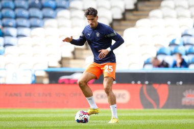 Theo Corbeanu #25 of Blackpool warms up before the Sky Bet Championship match Huddersfield Town vs Blackpool at John Smith's Stadium, Huddersfield, United Kingdom, 4th September 202
